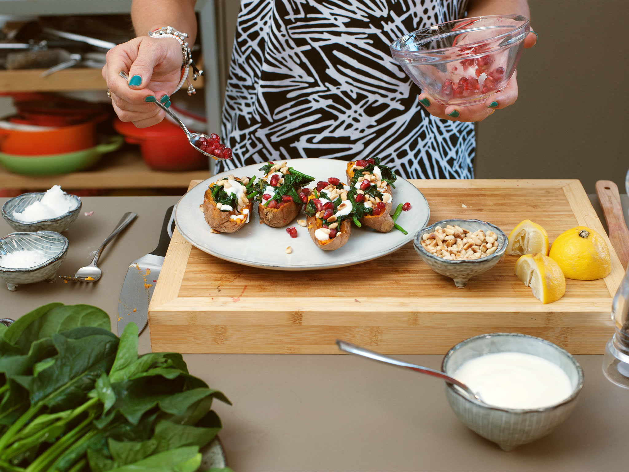 Baked sweet potatoes with spinach and pine nuts